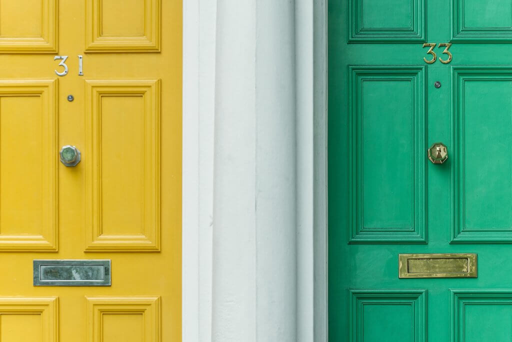 Apartment units with green and yellow doors