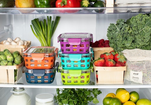 fresh veggies sorted stacked and stored in the fridge