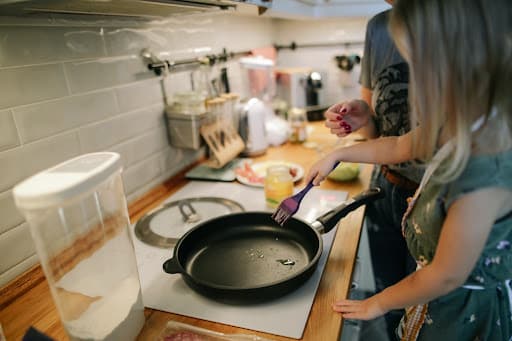 woman and daughter cooking