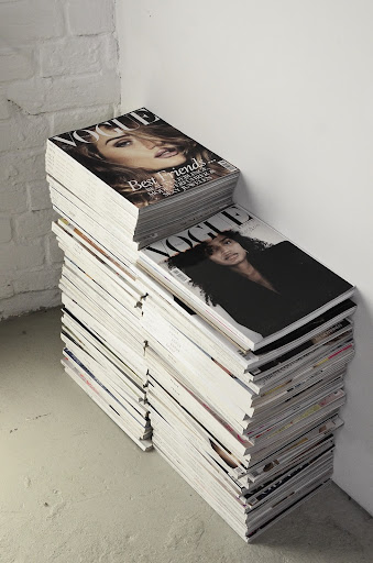 two stacks of vogue magazines